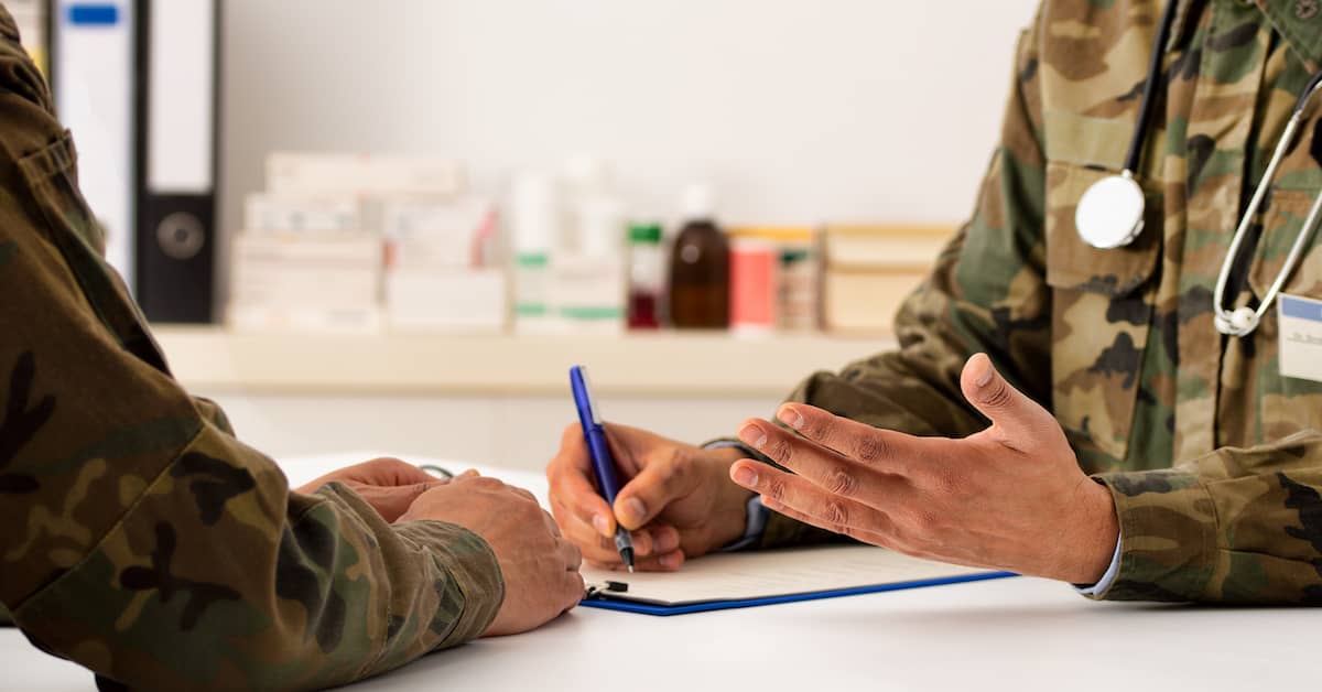 sick veteran consulting military doctor