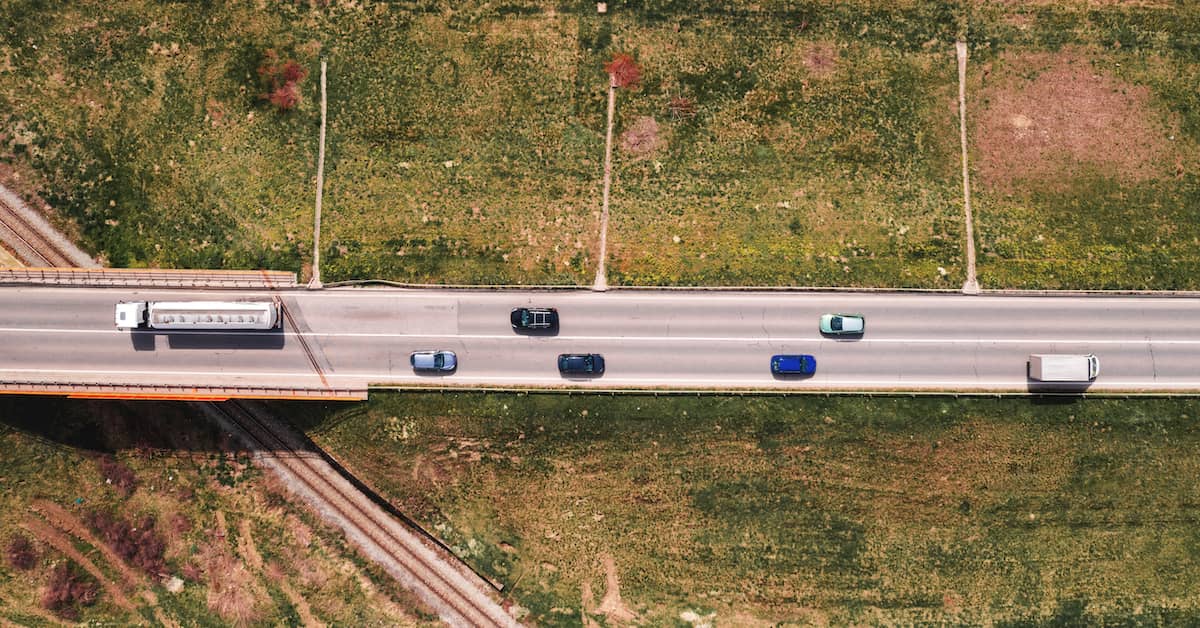 aerial view of semi-truck and other traffic on an overpass