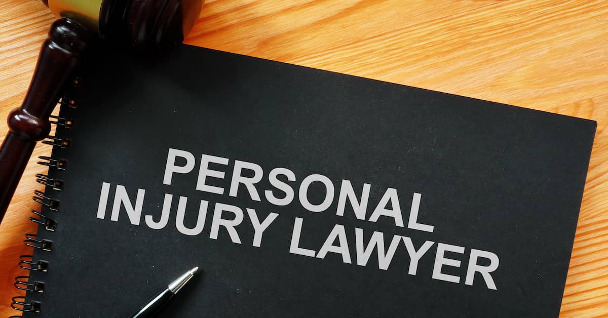 spiral notebook titled 'Personal Injury Lawyer'