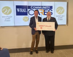 attorney Ben Whitley presenting a charitable donation check to The Salvation Army of Wake County
