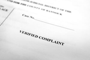 A piece of paper says "verified complaint" on it and somebody wonders how to file a complaint against Lyft.