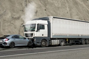 A car and commercial truck collide on a roadway. The car driver wonders: “How long would my truck accident case take to settle?”